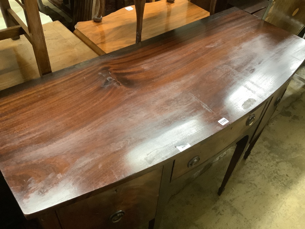 A late 19th century Sheraton style mahogany bowfront sideboard, fitted three drawers, length 140cm, depth 58cm, height 89cm